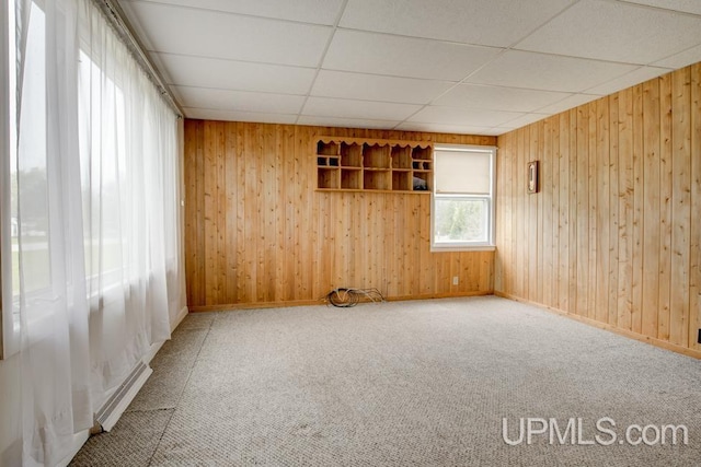1782 H Rd, Bark River, MI 49807 - empty room with wooden walls, baseboards, carpet, and a drop ceiling