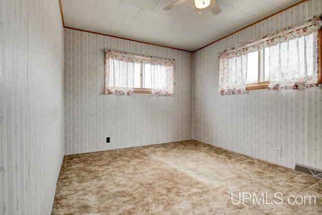 1782 H Rd, Bark River, MI 49807 - unfurnished room featuring ornamental molding, carpet, wallpapered walls, and ceiling fan
