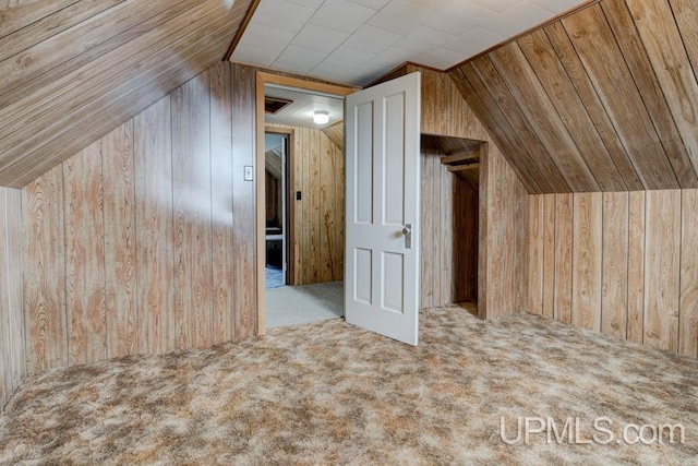 1782 H Rd, Bark River, MI 49807 - additional living space featuring wood walls, lofted ceiling, and carpet floors