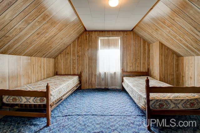 1782 H Rd, Bark River, MI 49807 - bedroom with wood walls, carpet flooring, and lofted ceiling
