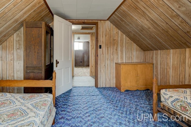 1782 H Rd, Bark River, MI 49807 - carpeted bedroom featuring wood walls and vaulted ceiling