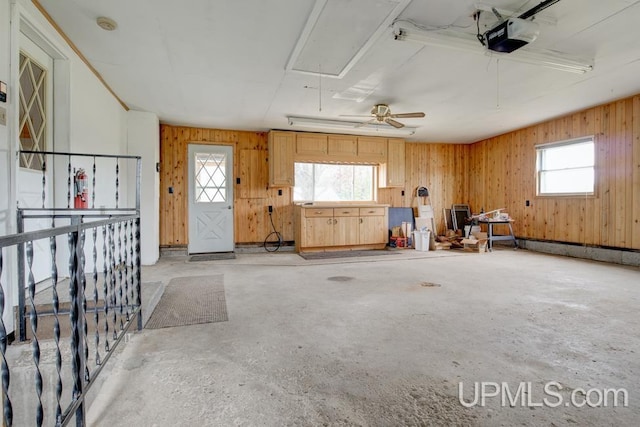 1782 H Rd, Bark River, MI 49807 - garage featuring a garage door opener and wooden walls