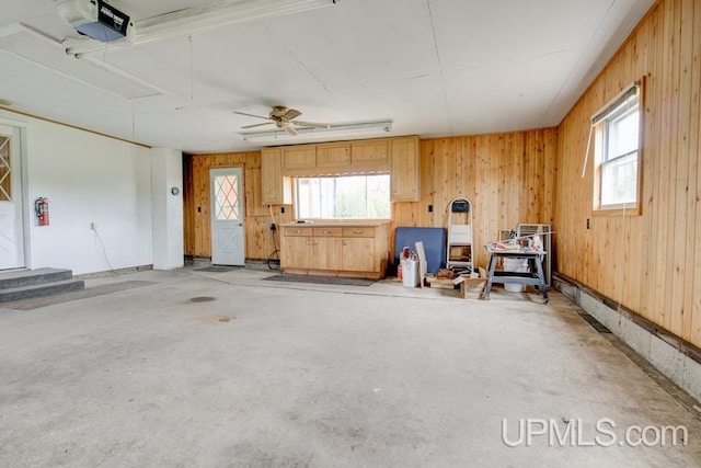 1782 H Rd, Bark River, MI 49807 - garage featuring a garage door opener and wood walls