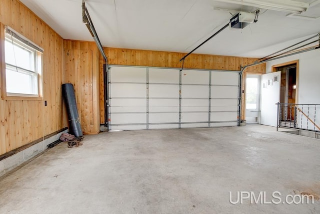 1782 H Rd, Bark River, MI 49807 - garage featuring a garage door opener and wood walls