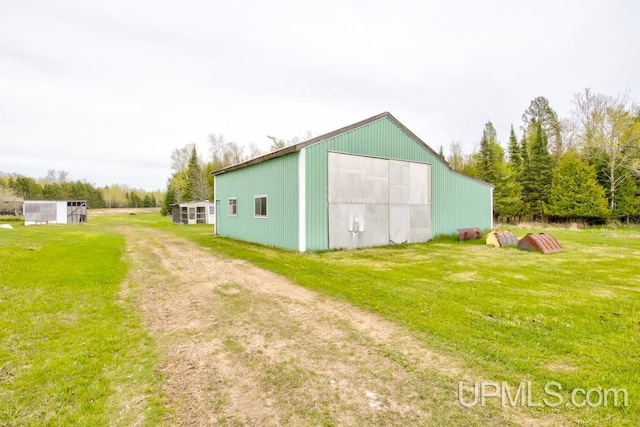 1782 H Rd, Bark River, MI 49807 - view of pole building with a yard and driveway