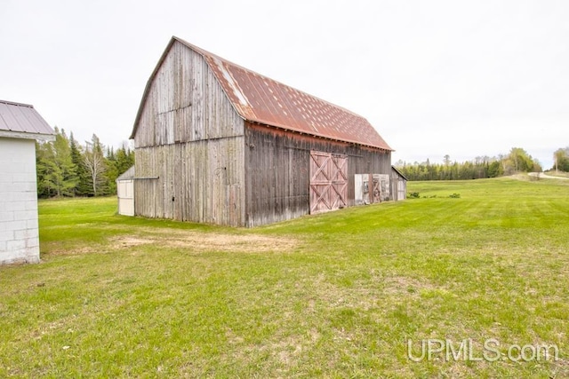 1782 H Rd, Bark River, MI 49807 - view of barn with a lawn