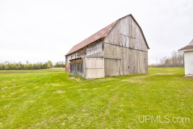 1782 H Rd, Bark River, MI 49807 - view of barn featuring a lawn