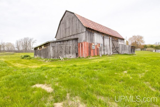 1782 H Rd, Bark River, MI 49807 - view of barn featuring a yard