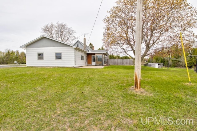 1782 H Rd, Bark River, MI 49807 - rear view of property featuring a patio area and a chimney