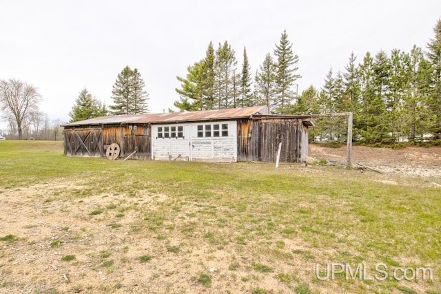 1782 H Rd, Bark River, MI 49807 - view of pole building with a lawn