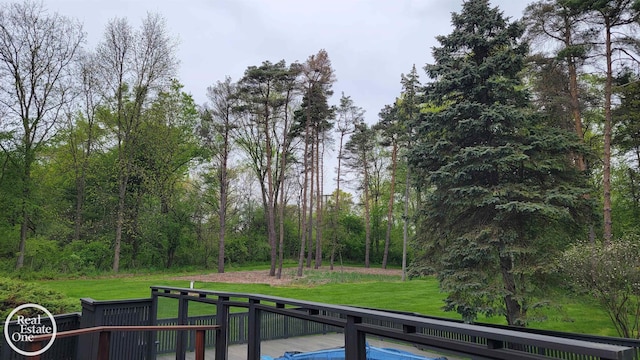 966 Pine Needle Trl, Oakland Twp, MI 48306 - dock featuring a wooden deck and a yard