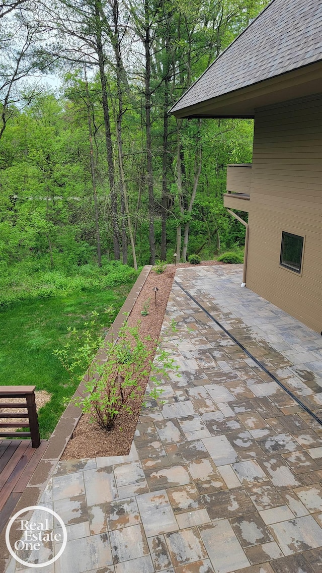 966 Pine Needle Trl, Oakland Twp, MI 48306 - view of patio with a wooded view
