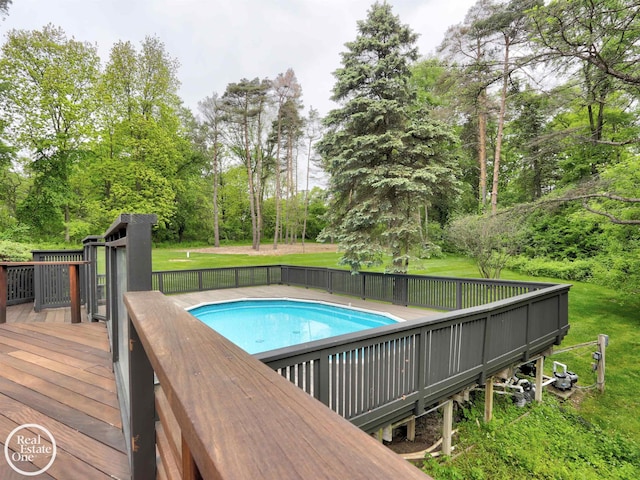 966 Pine Needle Trl, Oakland Twp, MI 48306 - view of pool with a wooden deck, a yard, and view of scattered trees