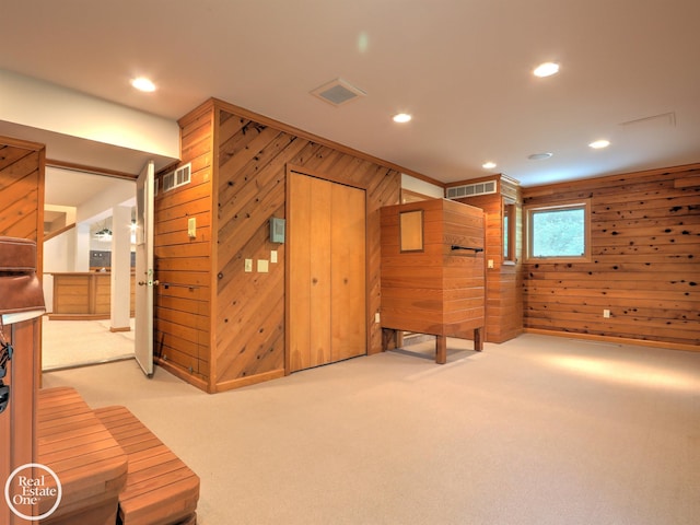 966 Pine Needle Trl, Oakland Twp, MI 48306 - unfurnished bedroom with wooden walls, carpet floors, and recessed lighting