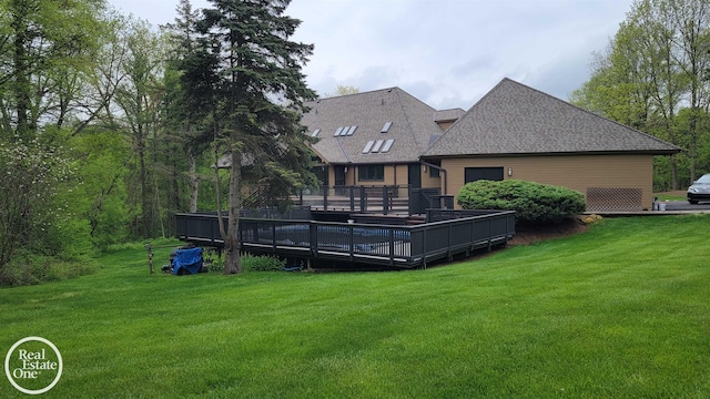 966 Pine Needle Trl, Oakland Twp, MI 48306 - rear view of house with a lawn, a deck, and a shingled roof