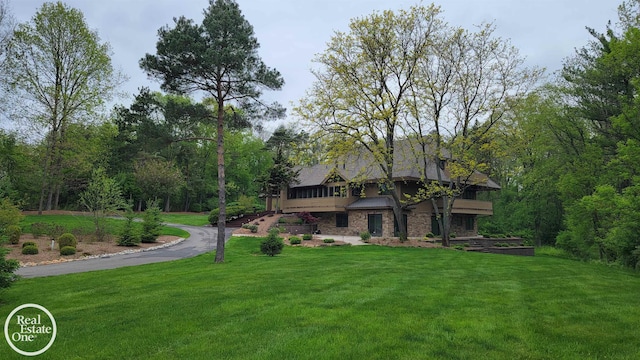 966 Pine Needle Trl, Oakland Twp, MI 48306 - exterior space featuring a front yard and stone siding