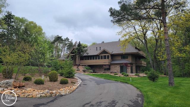 966 Pine Needle Trl, Oakland Twp, MI 48306 - view of front of home with a front lawn and stone siding