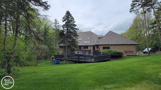 966 Pine Needle Trl, Oakland Twp, MI 48306 - back of house featuring a yard, a wooden deck, and a shingled roof