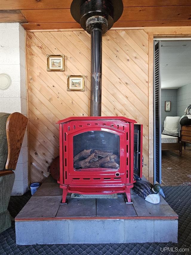 10162 Wyoming Rd, Mohawk, MI 49918 - detailed view of a wood stove and wooden walls