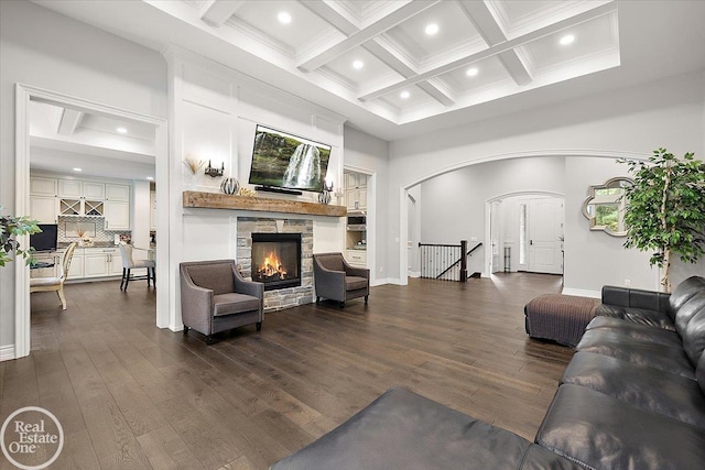 60330 Mount Vernon Rd, Washington Twp, MI 48306 - living room with arched walkways, a stone fireplace, recessed lighting, coffered ceiling, and beam ceiling
