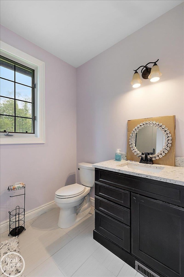 60330 Mount Vernon Rd, Washington Twp, MI 48306 - bathroom with baseboards, vanity, toilet, and tile patterned flooring