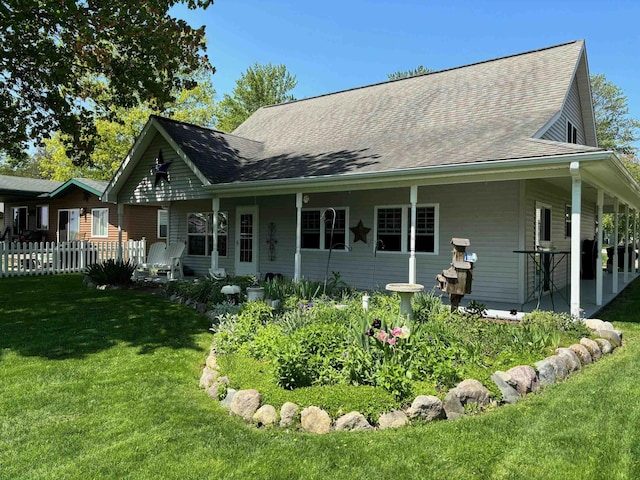 3214 Elnor Dr, Gladwin, MI 48624 - rear view of property featuring roof with shingles and a porch