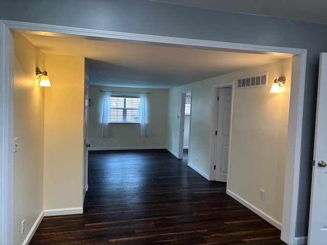 3214 Elnor Dr, Gladwin, MI 48624 - spare room with dark wood-style flooring and baseboards