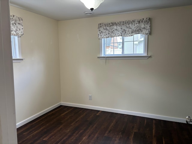 3214 Elnor Dr, Gladwin, MI 48624 - empty room featuring baseboards and dark wood finished floors