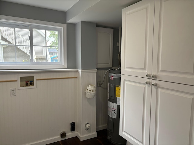 3214 Elnor Dr, Gladwin, MI 48624 - laundry room with electric water heater, cabinet space, wainscoting, washer hookup, and dark wood-style flooring