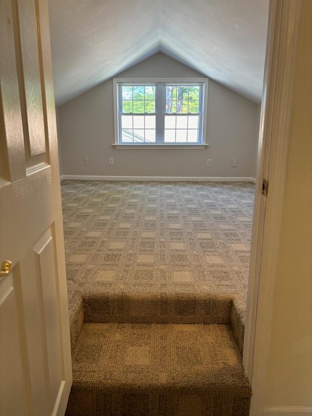 3214 Elnor Dr, Gladwin, MI 48624 - stairs featuring vaulted ceiling and carpet floors