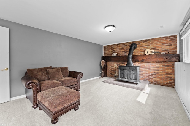 8912 Hubbard St, Livonia, MI 48150 - living area featuring a wood stove, brick wall, and baseboards