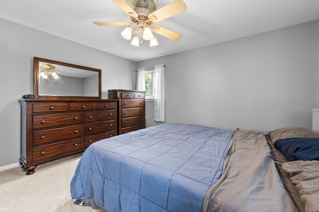 8912 Hubbard St, Livonia, MI 48150 - bedroom with light colored carpet, ceiling fan, and baseboards