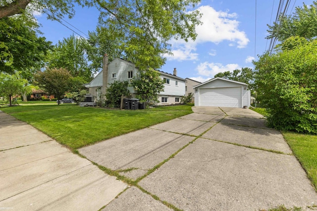 8912 Hubbard St, Livonia, MI 48150 - view of front of house featuring a chimney, an outbuilding, a garage, and a front yard