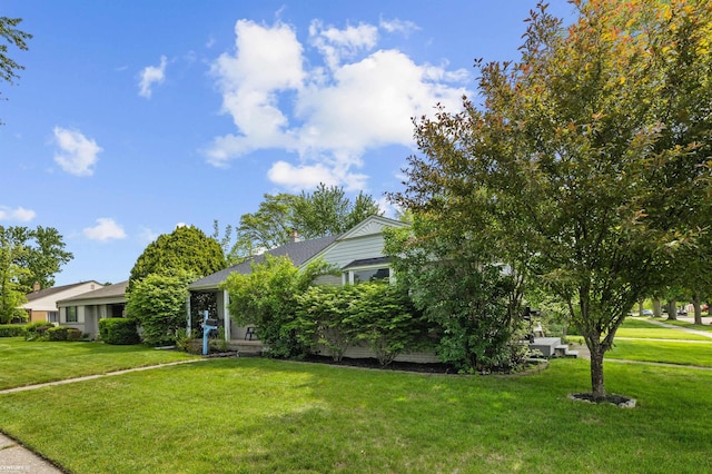8912 Hubbard St, Livonia, MI 48150 - view of front of house with a front yard and a chimney