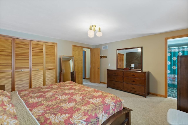 39463 Baroque Blvd, Clinton Township, MI 48038 - bedroom with light colored carpet, a closet, baseboards, and ensuite bath