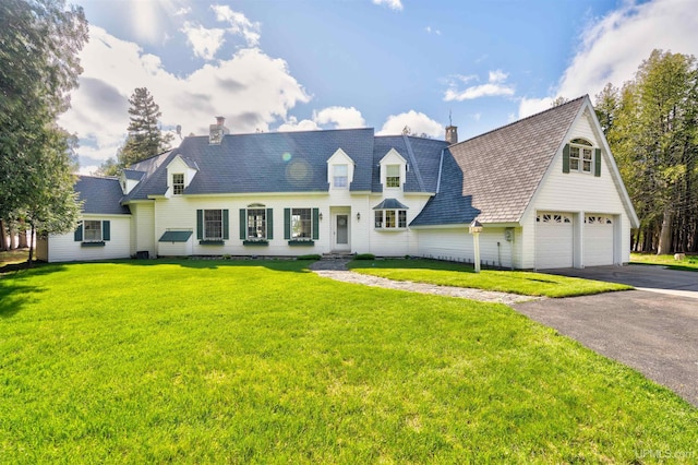 7975 00.25 Rd, Garden, MI 49835 - new england style home featuring driveway, a chimney, and a front yard