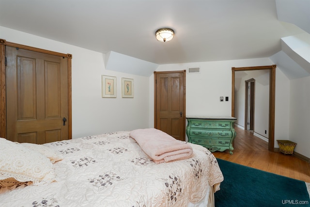 7975 00.25 Rd, Garden, MI 49835 - bedroom with wood finished floors