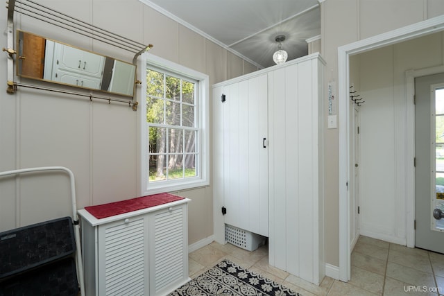 7975 00.25 Rd, Garden, MI 49835 - washroom with baseboards, light tile patterned floors, and crown molding