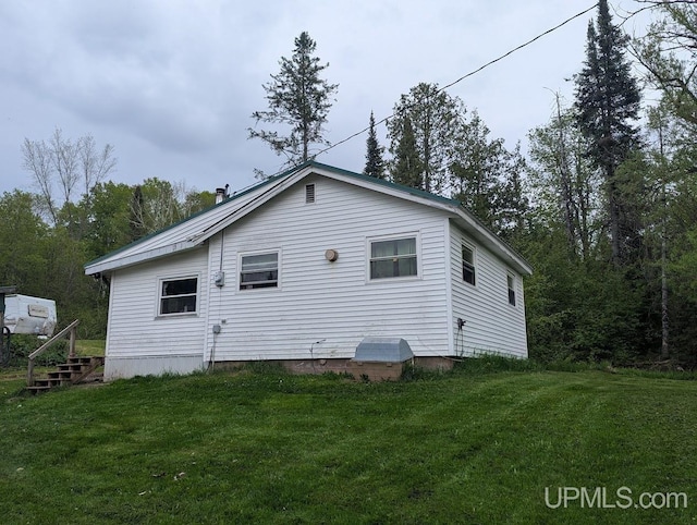 24662 Mud Creek Rd, Mass City, MI 49948 - view of property exterior with a yard