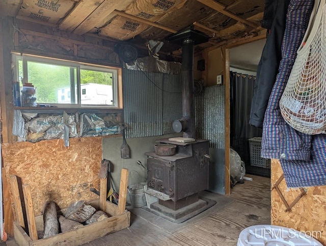 24662 Mud Creek Rd, Mass City, MI 49948 - kitchen with a wood stove and wood finished floors