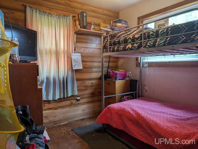 24662 Mud Creek Rd, Mass City, MI 49948 - bedroom with wood finished floors and rustic walls