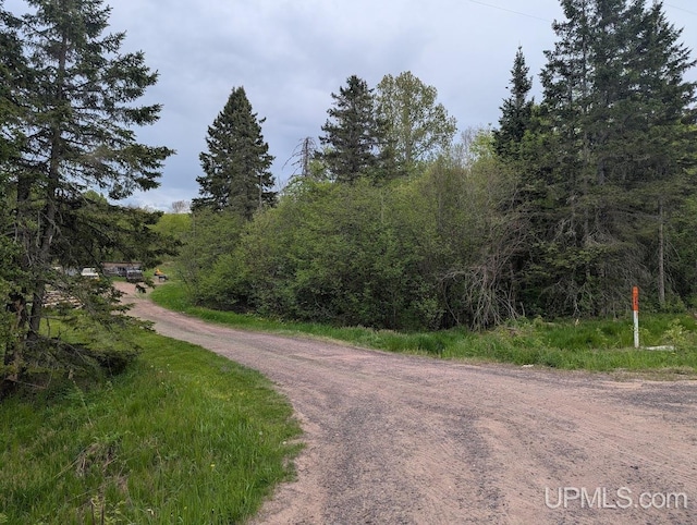 24662 Mud Creek Rd, Mass City, MI 49948 - view of dirt / gravel road featuring a wooded view