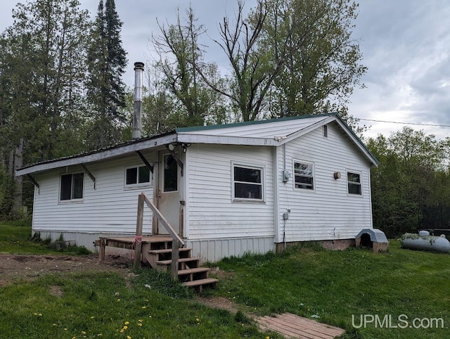 24662 Mud Creek Rd, Mass City, MI 49948 - back of property featuring a lawn