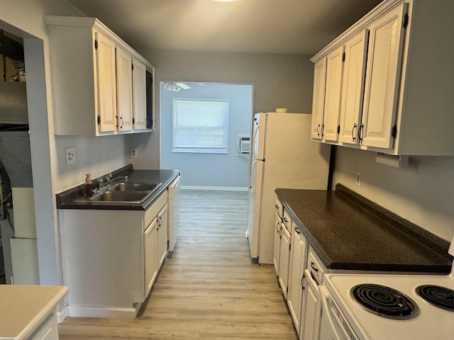 25230 Lehner St, Roseville, MI 48066 - kitchen featuring light wood-style flooring, white appliances, dark countertops, and a sink