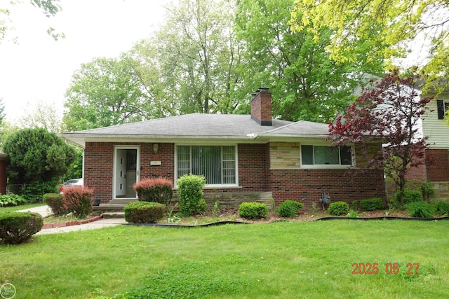 20618 Woodside St, Harper Woods, MI 48225 - view of front of house featuring a chimney, a front lawn, and brick siding