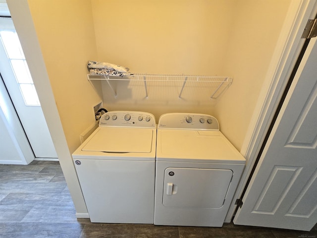 32782 N Susan Ln, New Haven, MI 48048 - laundry area featuring washing machine and dryer, dark wood-type flooring, and baseboards