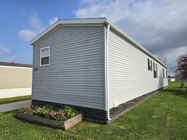 32782 N Susan Ln, New Haven, MI 48048 - view of property exterior featuring a lawn
