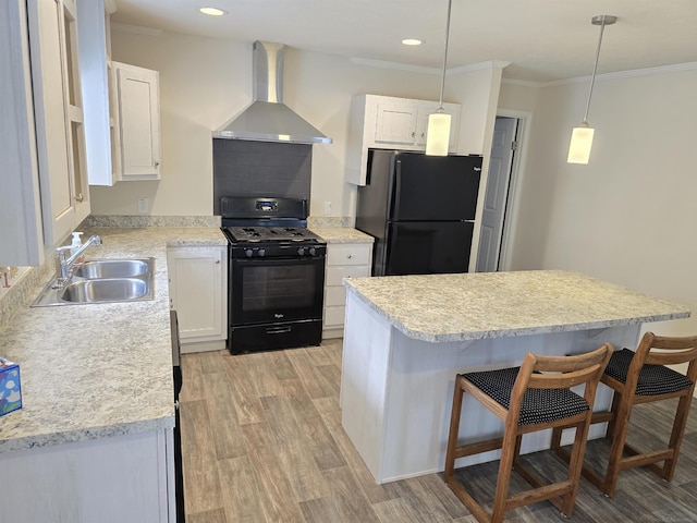 32782 N Susan Ln, New Haven, MI 48048 - kitchen featuring wall chimney range hood, black appliances, a sink, light countertops, and crown molding
