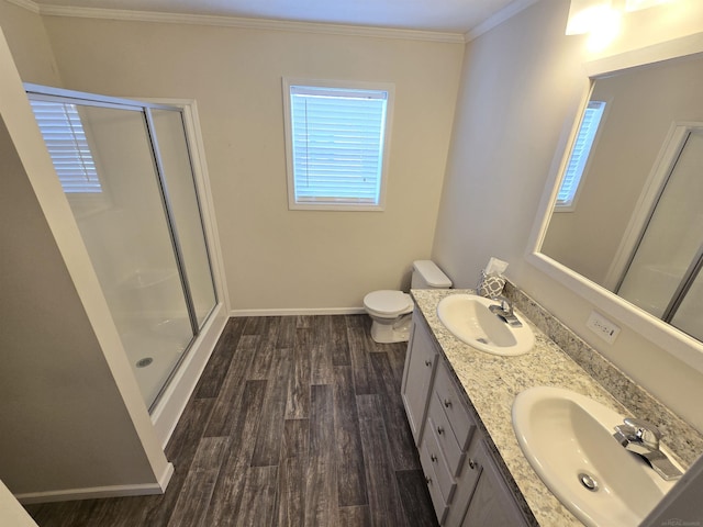 32782 N Susan Ln, New Haven, MI 48048 - bathroom featuring baseboards, a stall shower, ornamental molding, double vanity, and wood finished floors