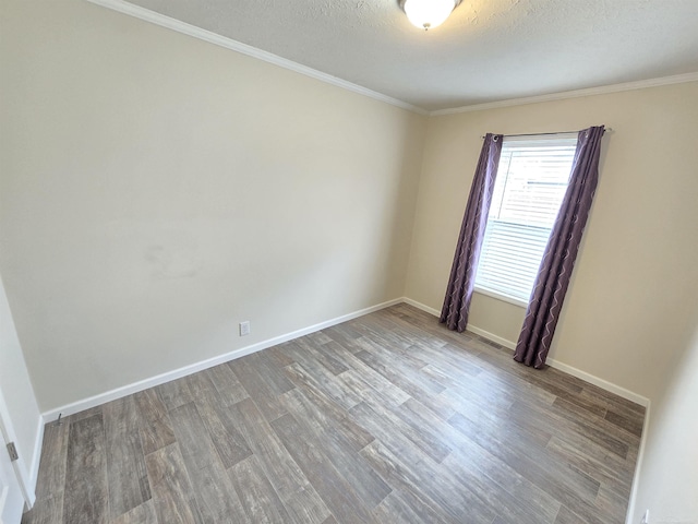 32782 N Susan Ln, New Haven, MI 48048 - unfurnished room featuring wood finished floors, ornamental molding, baseboards, and a textured ceiling